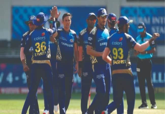 Mumbai Indians (MI) celebrating after taking a wicket.